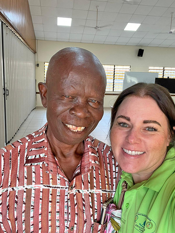 Man and woman smiling.