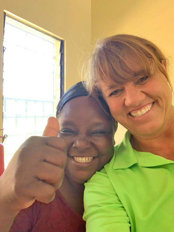 Two women friends smiling.